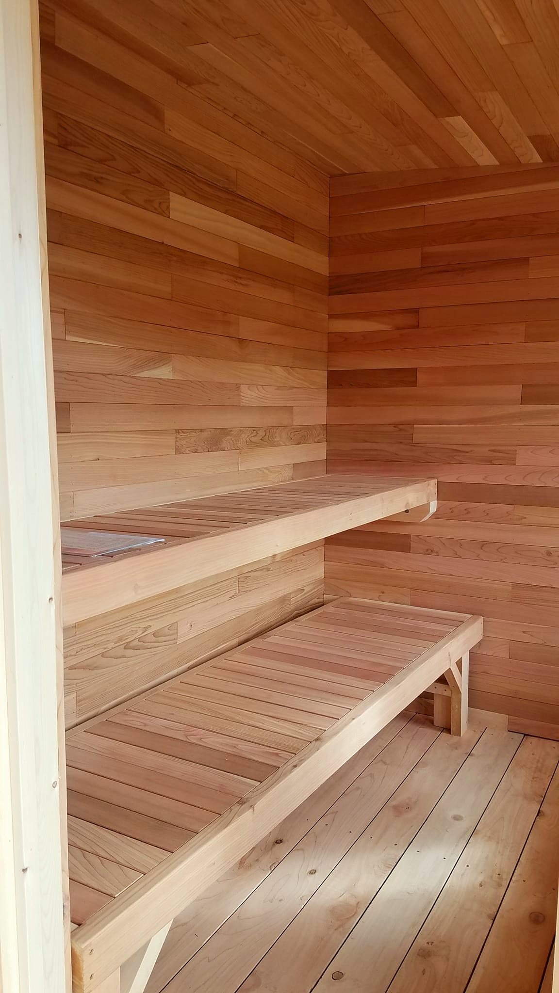 Custom cedar sauna interior built by Mixon Bros. Construction